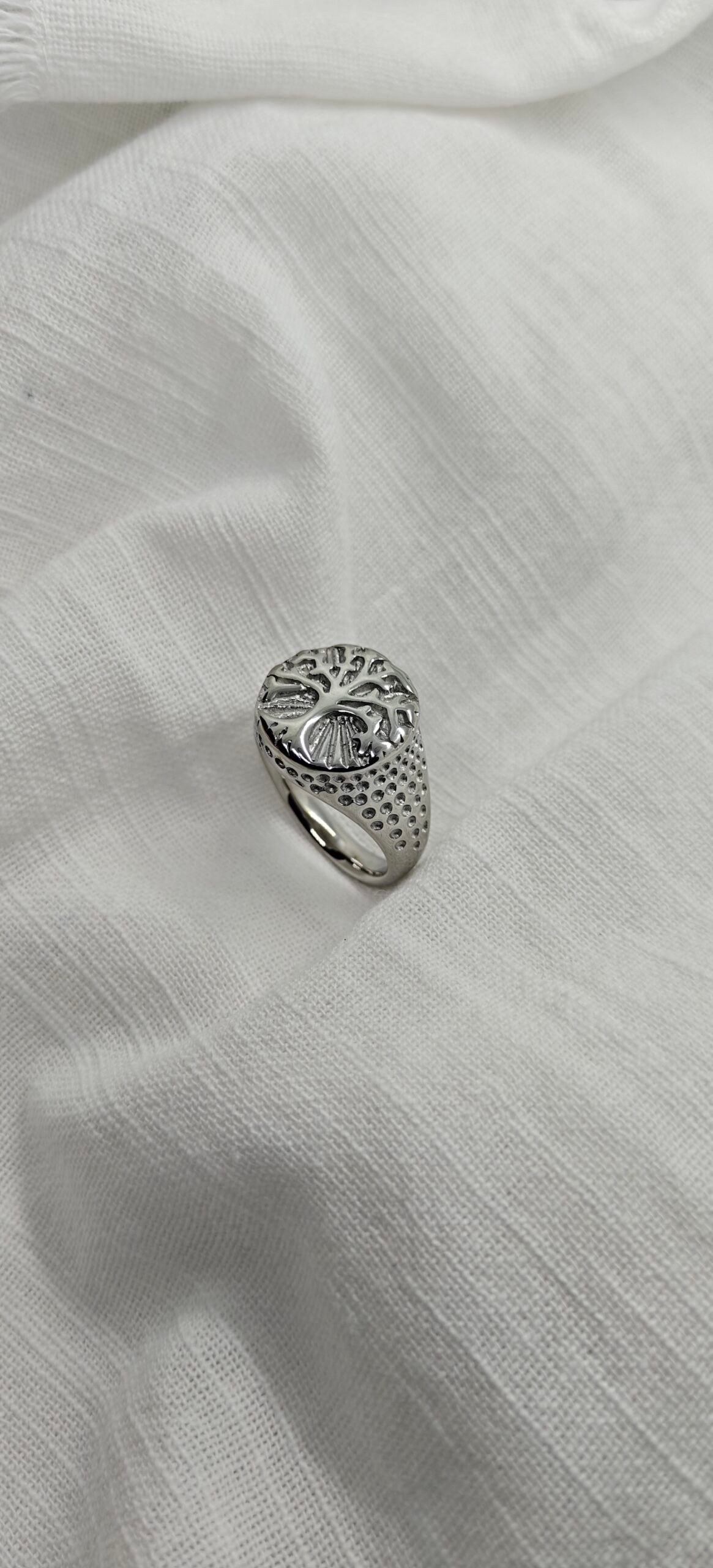 Size 11 Stainless steel Tree of Life ring with carved detailing on band.