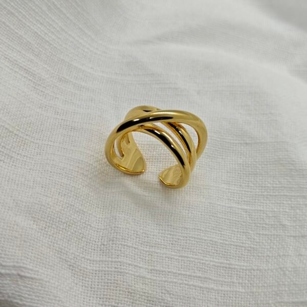 Size 9 gold-plated stainless steel crossover ring. Modern, durable, and hypoallergenic
