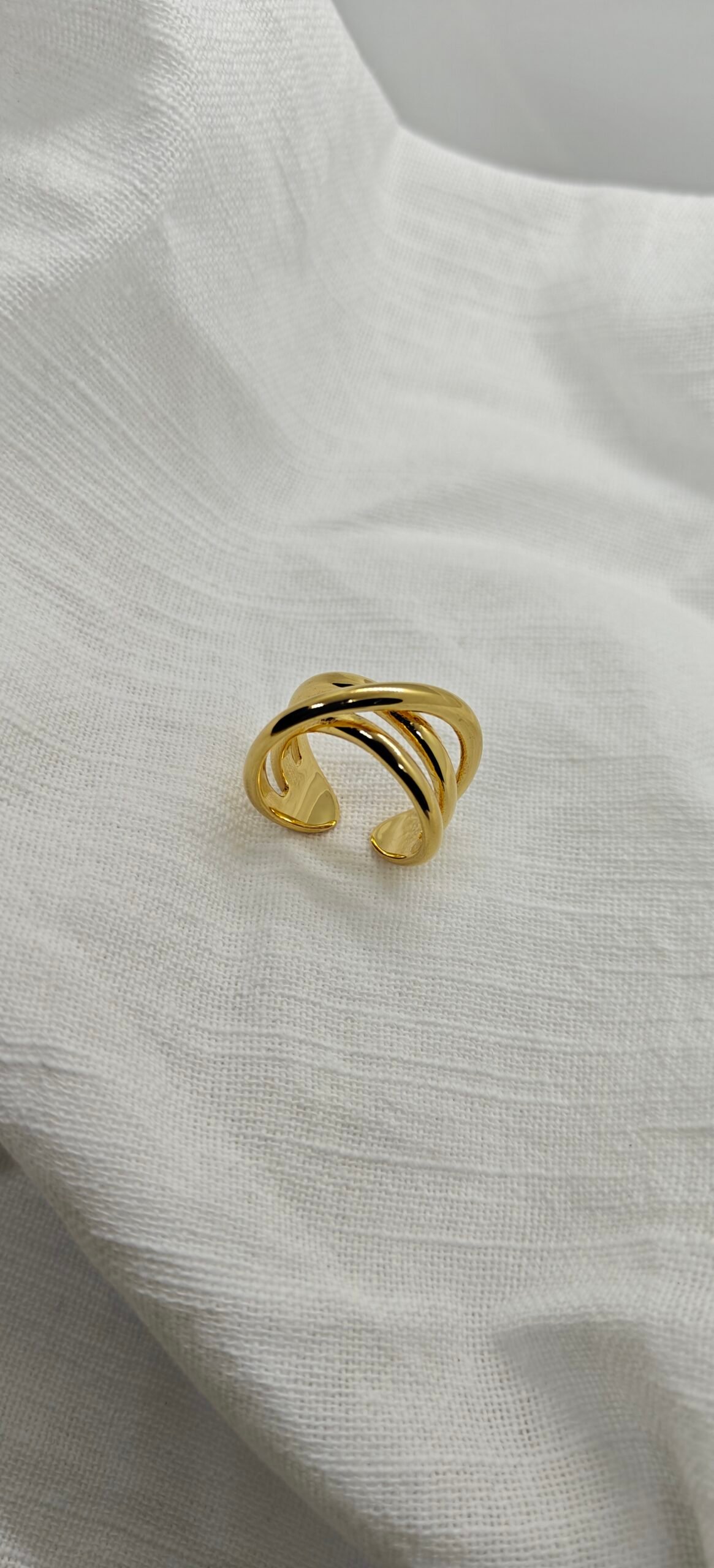 Size 9 gold-plated stainless steel crossover ring. Modern, durable, and hypoallergenic