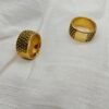 Woven gold plated stainless steel ring on fabric – Herdise