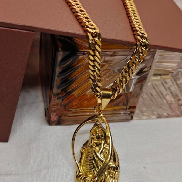 Bold gold stainless steel skeleton pendant necklace with a heavy curb chain. Durable, tarnish-resistant, and perfect for streetwear or statement styling.