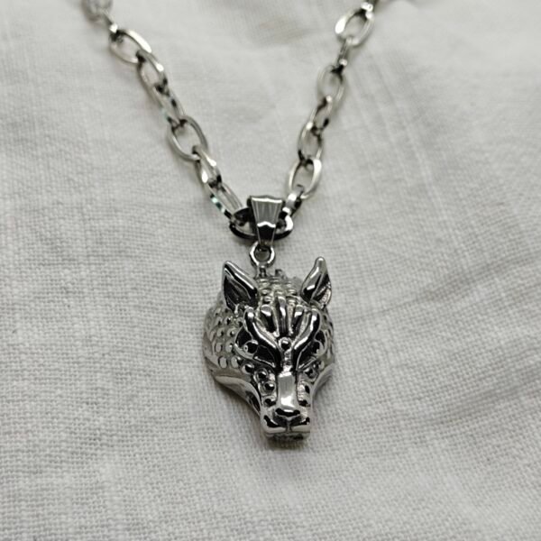 “Wolf head stainless steel pendant necklace with roval chain.”
