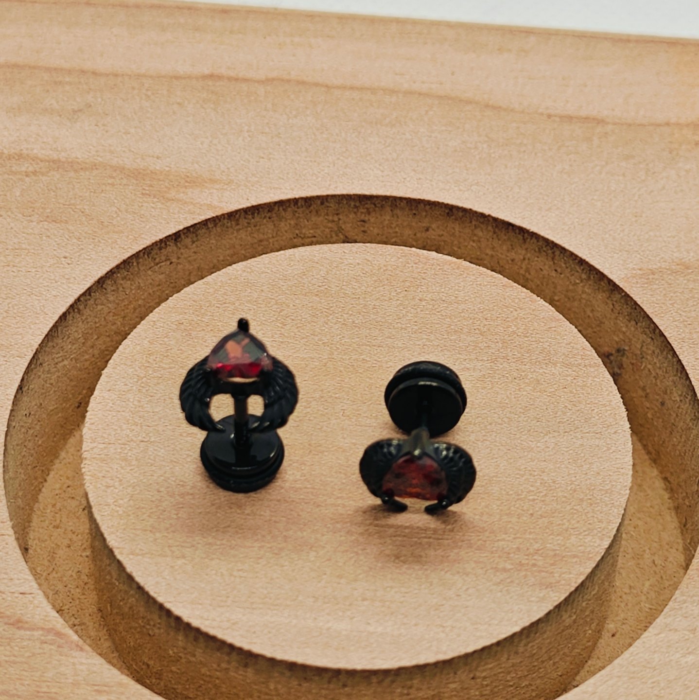winged heart screw back earrings black with ruby stone