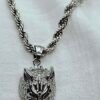 “Wolf head stainless steel pendant necklace with 24" rope chain.”