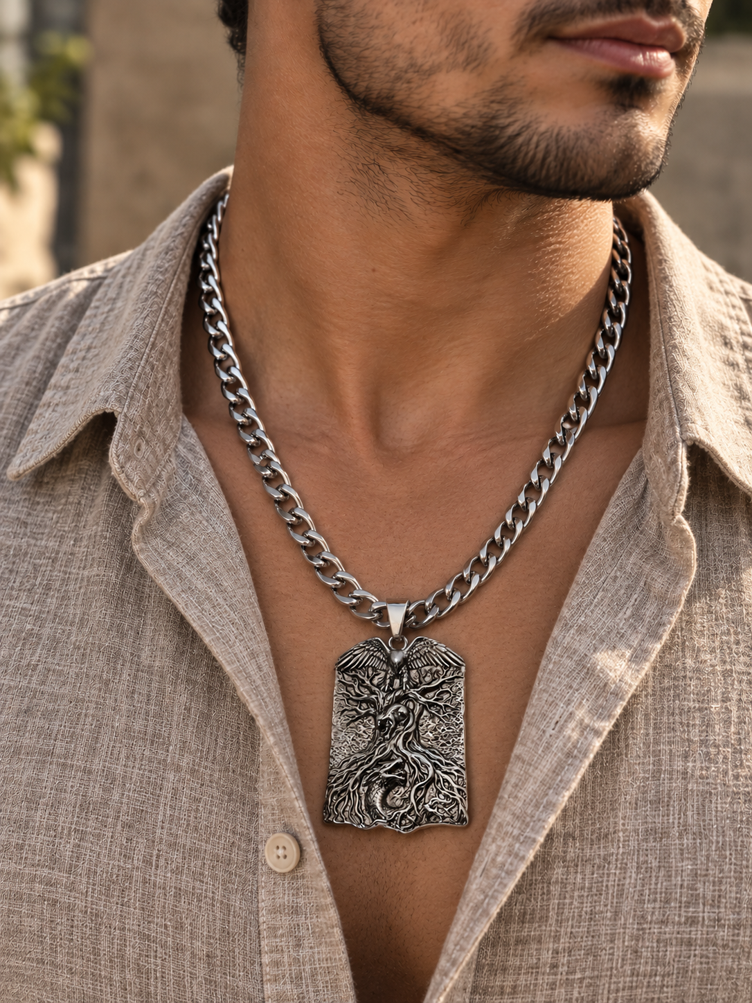 Man wearing silver Yggdrasil World Tree pendant necklace