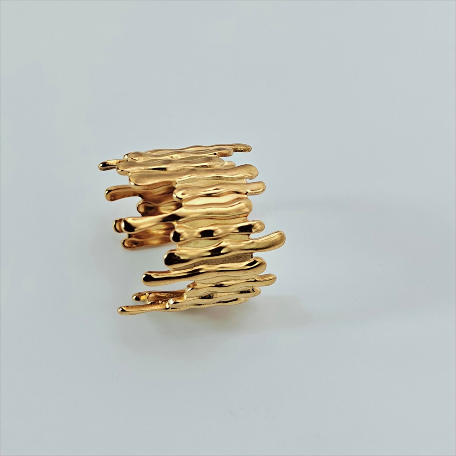 Size 10 Molten Muse gold-tone statement ring with sculptural liquid-drip design