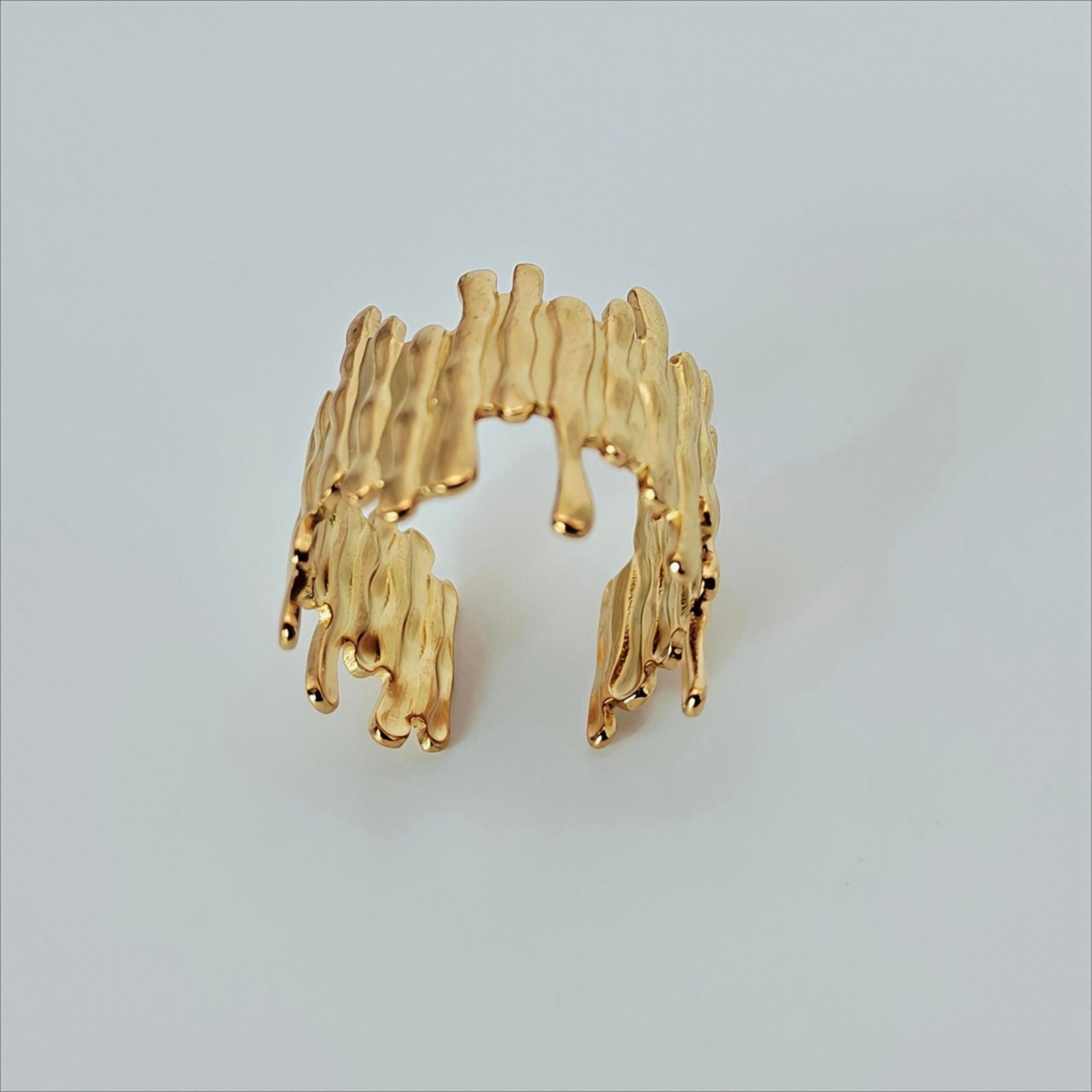 Size 9 Molten Muse gold-tone statement ring with sculptural liquid-drip design