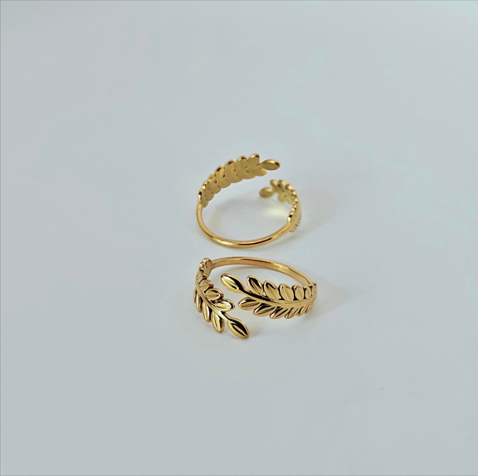 HERDISE Golden Laurel gold-tone ring with sculpted double-leaf branches and open-wrap band