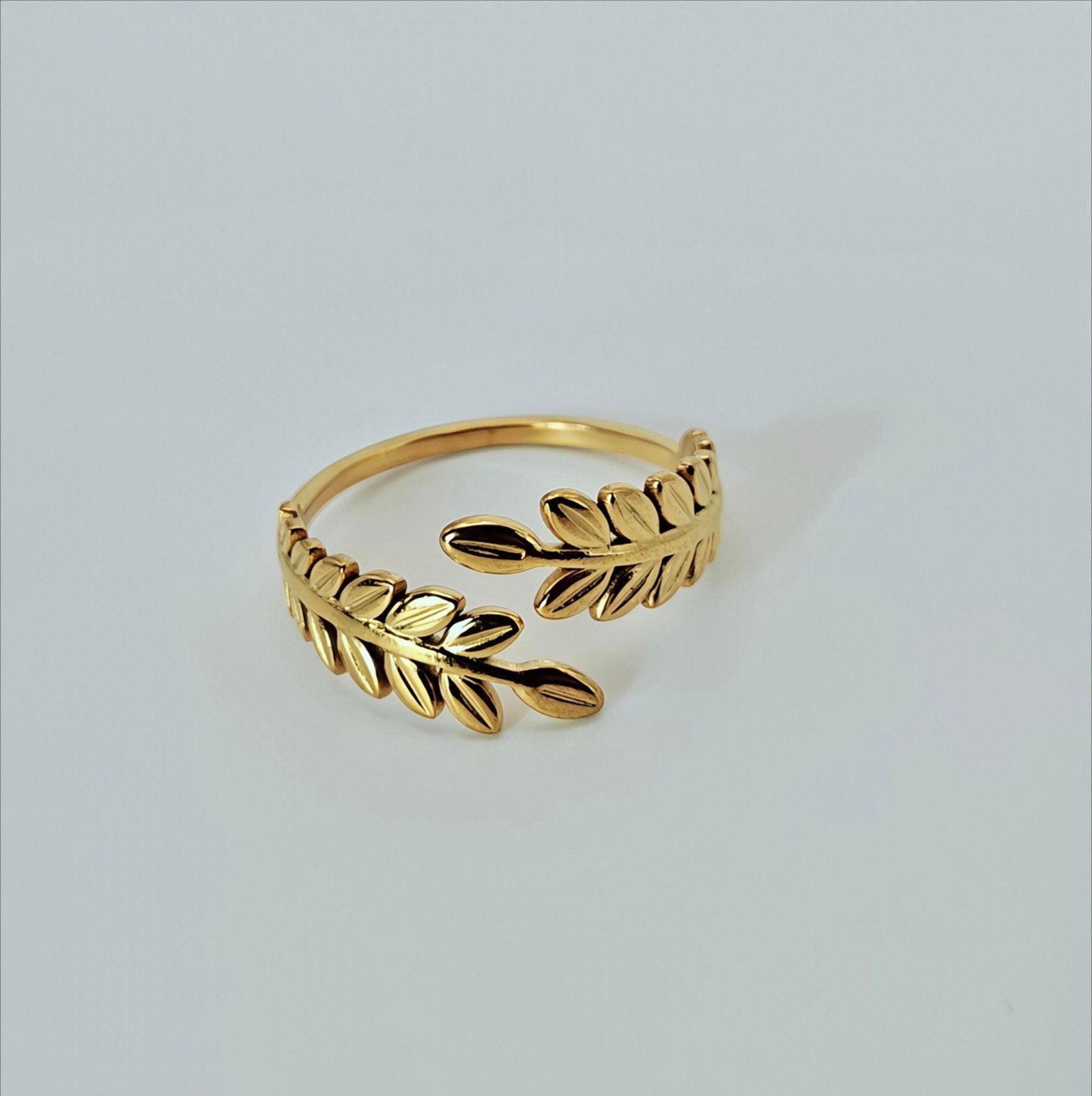 Size 7 Golden Laurel gold-tone ring with sculpted double-leaf branches and open-wrap band