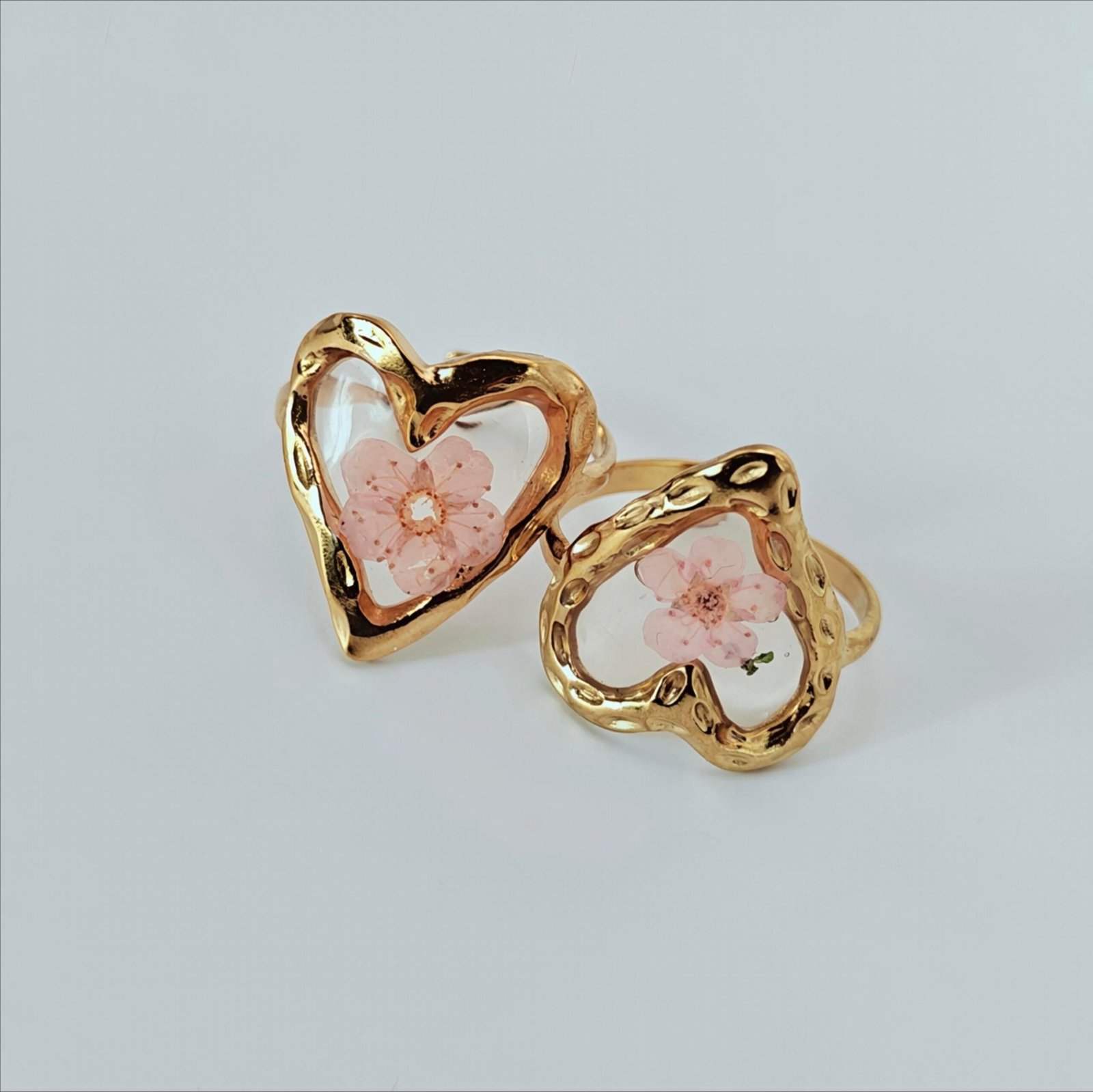 HERDISE Sakura Bloom gold-tone heart ring with pink flower and transparent centerpiece