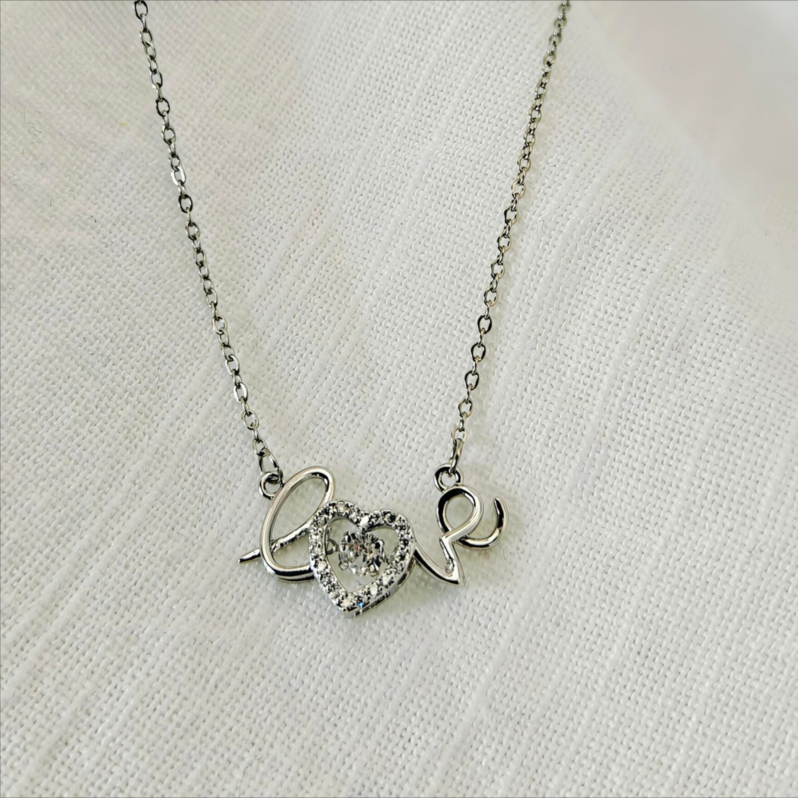 HERDISE Forever Love silver-tone script necklace with sparkling heart centerpiece