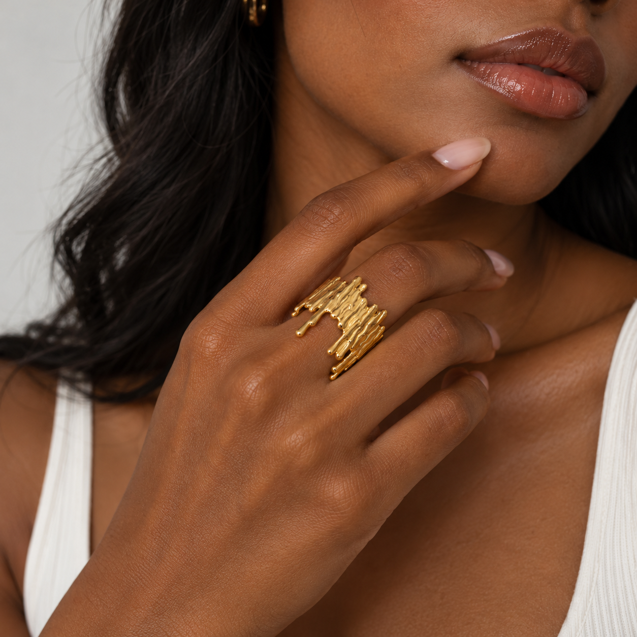 HERDISE Molten Muse gold-tone statement ring with sculptural liquid-drip design