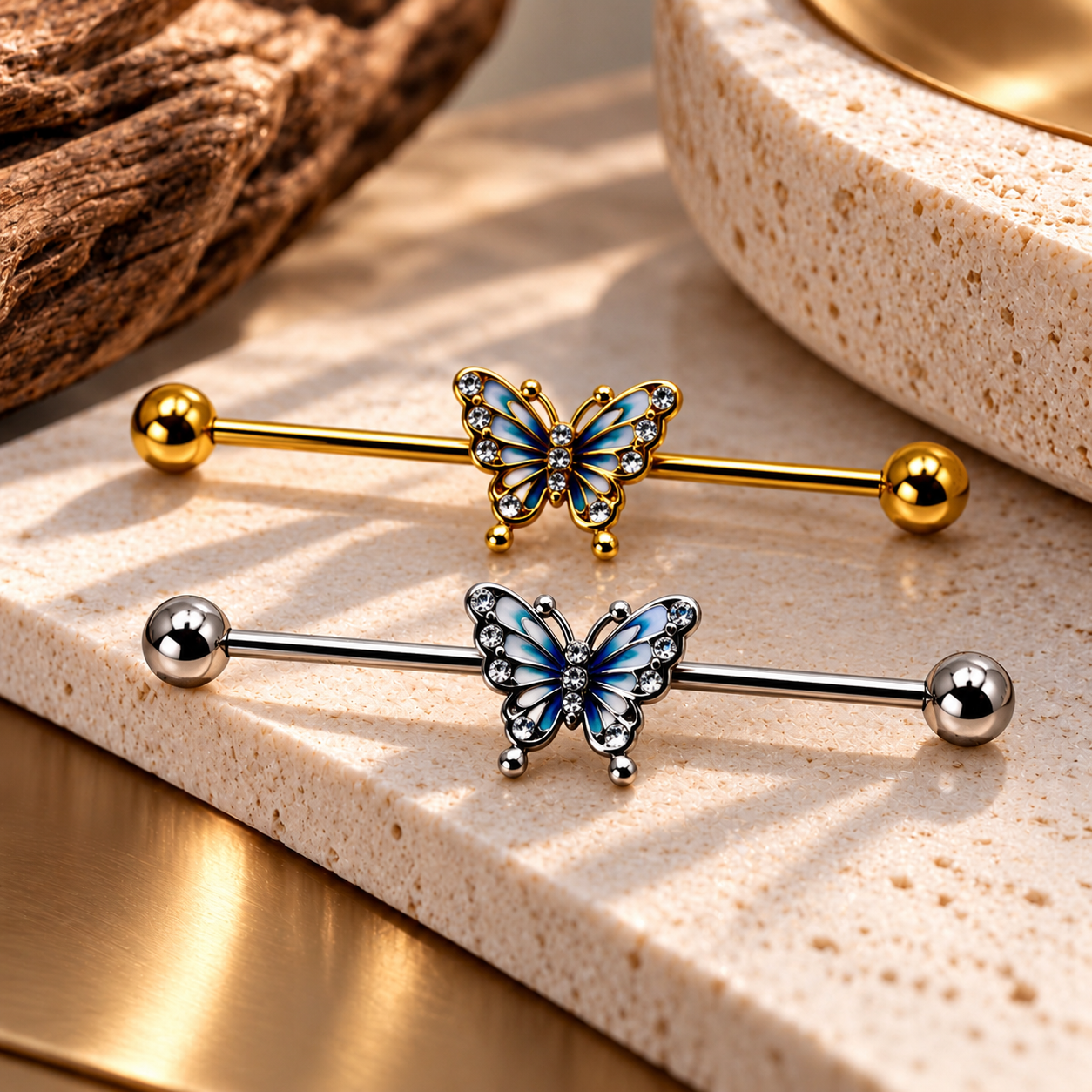 Gold and silver butterfly industrial barbells with blue wings and crystal accents