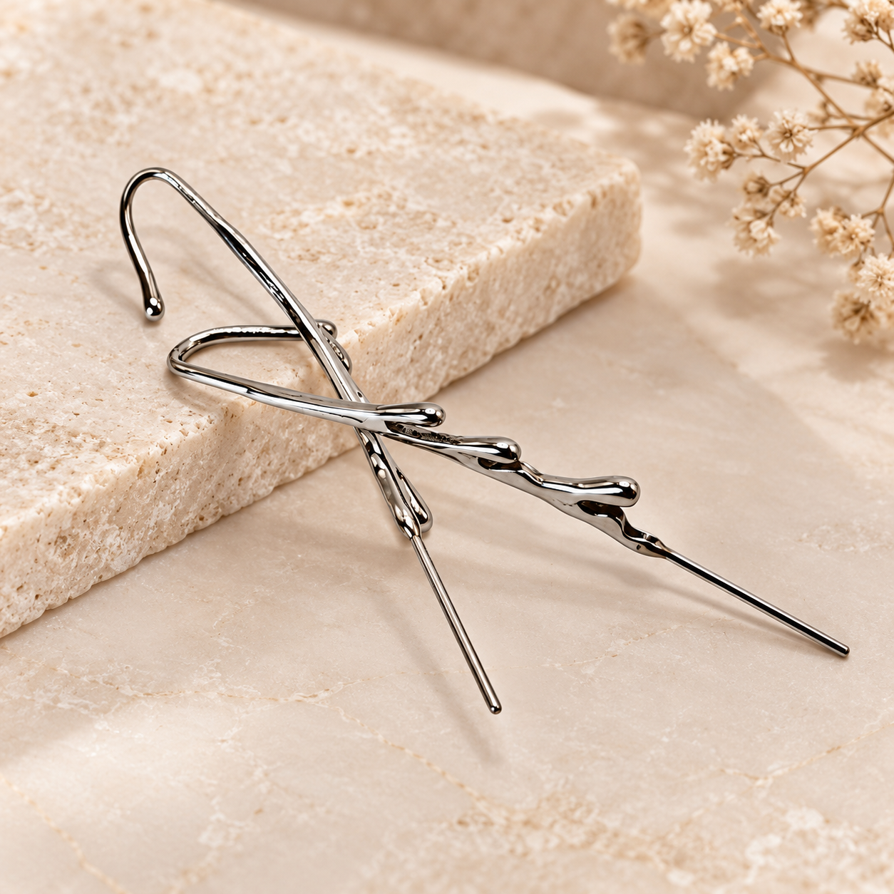 Silver fluid wave industrial-style ear crawler featuring polished curved metal lines